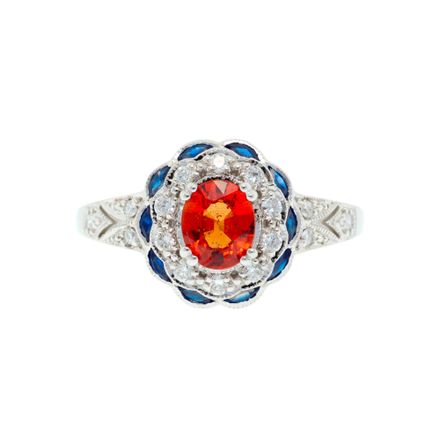 W/Goldring mit  einem ovalen Saphir-Orange, umgeben von brillanten Diamanten und Saphiren